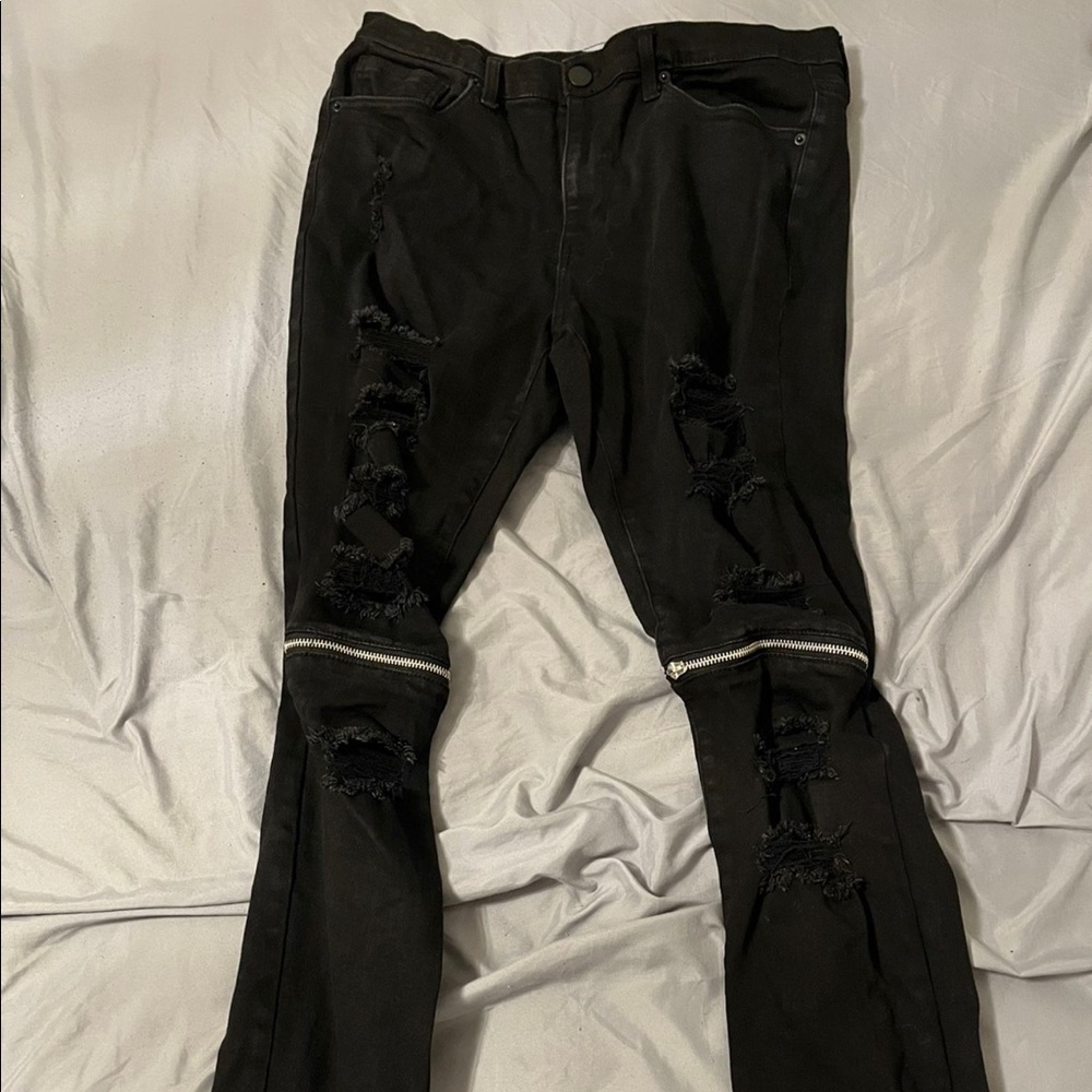I am selling ripped jeans with Zippers at the knee.